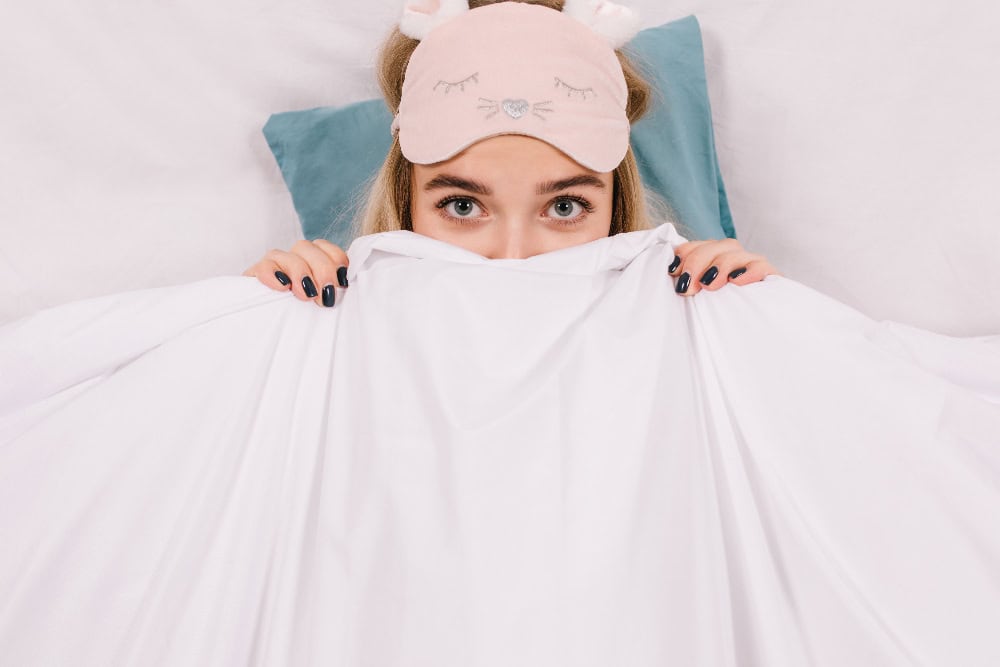 Woman wearing sleep mask