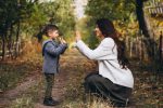 Mother with little son in an autumn park